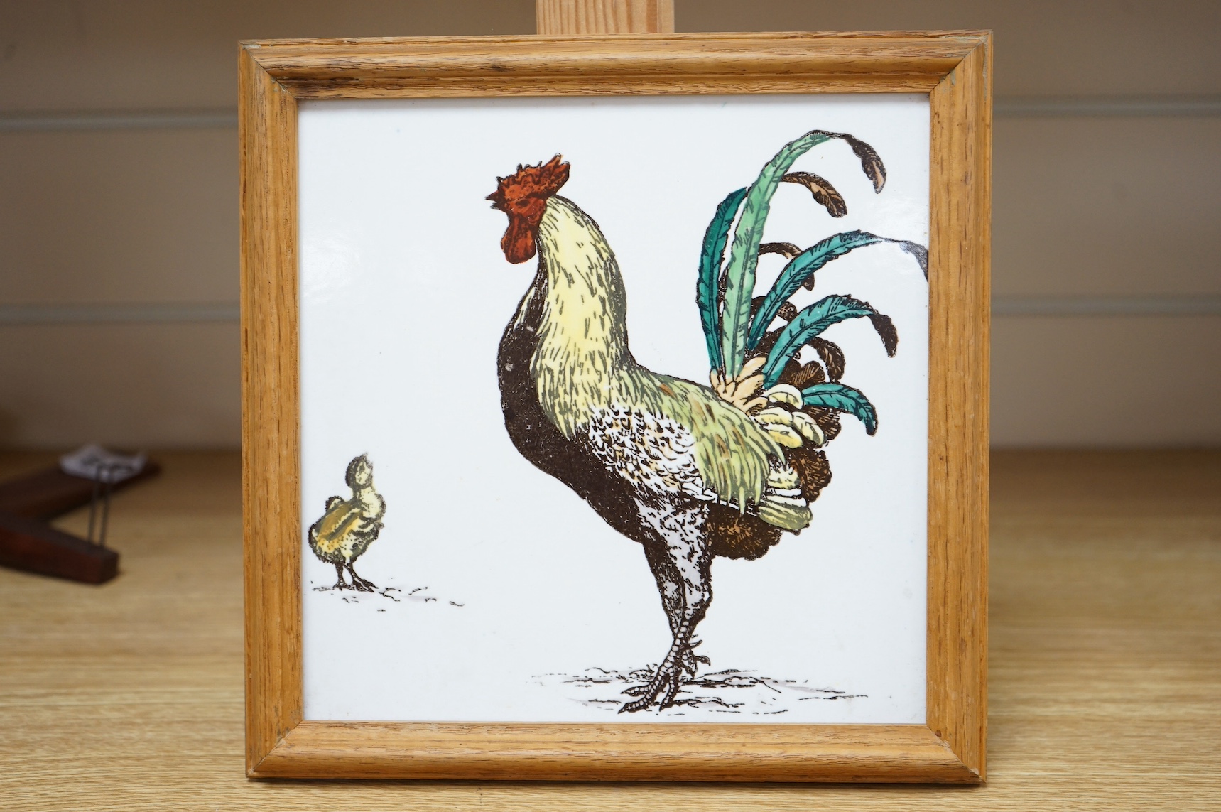 William Stephen Coleman for Mintons, a naturalist tile decorated with a rooster, framed, 24 x 23cm. Condition - fair